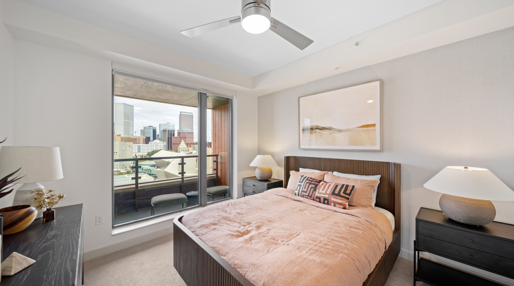 bedroom with nightstands and a large bed and window