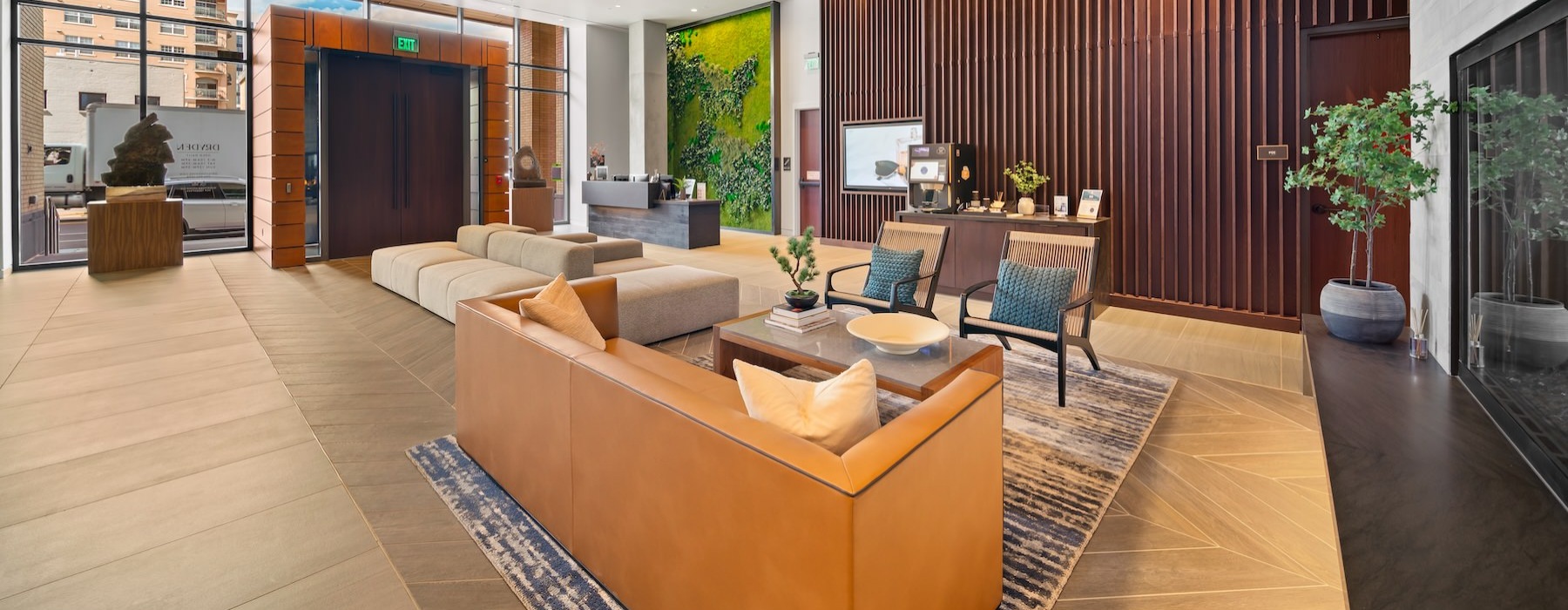 a large club room with a large glass wall