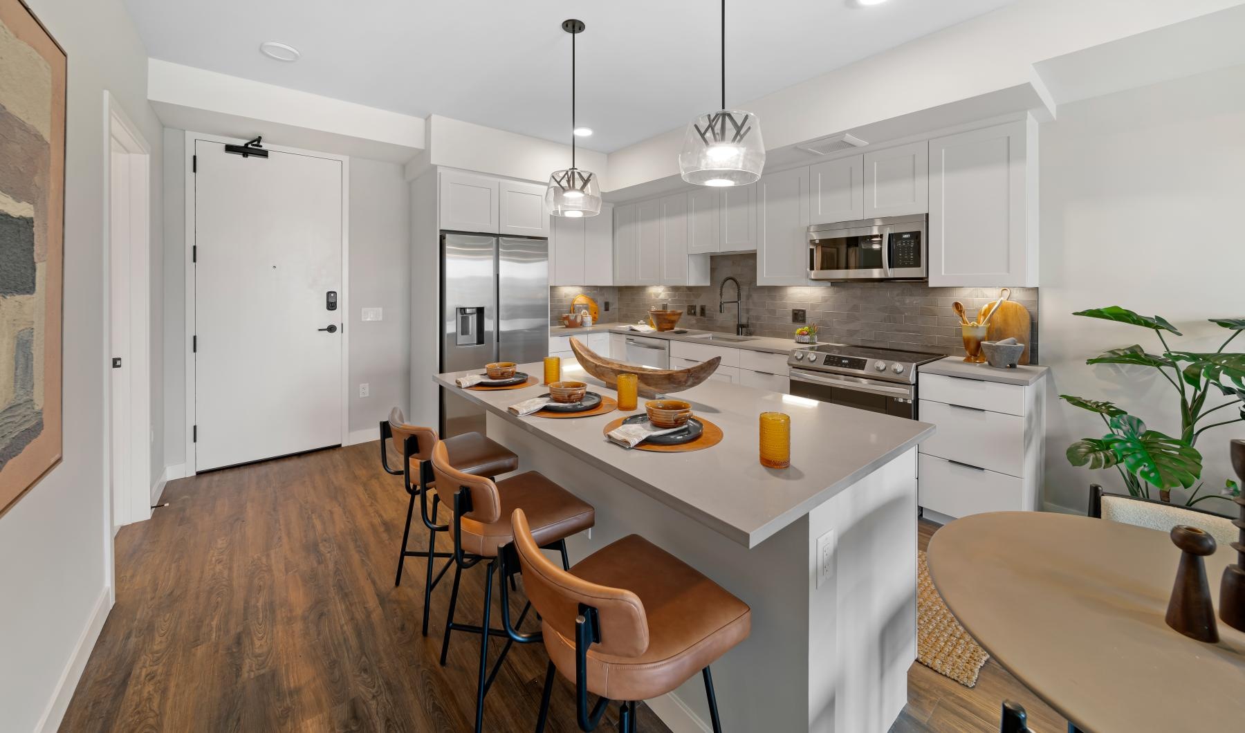 a kitchen with a table and chairs
